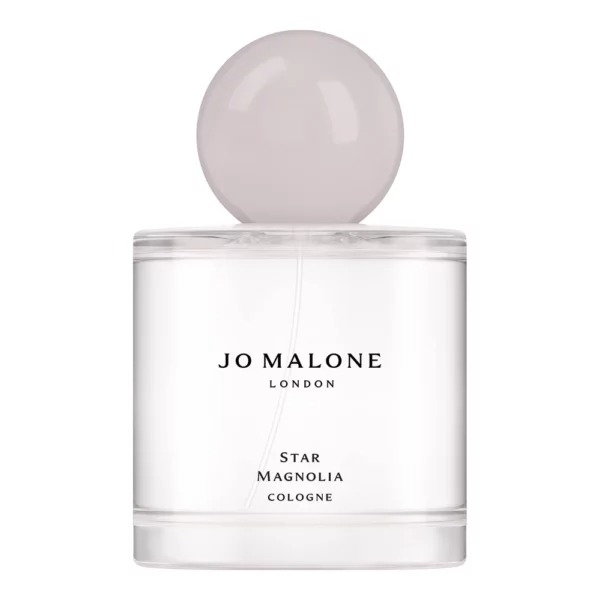 Jo Malone London Star Magnolia Cologne features a minimalist design with a round cap and clear bottle. The label displays the brand name and fragrance type, emphasizing its elegance and simplicity.