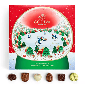 A Godiva Limited Edition Advent Calendar with a festive design and several assorted chocolates displayed in front.