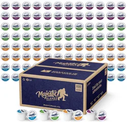 Assorted coffee pods from Majestic Blends, neatly arranged above a large box. Various flavors are indicated by different colored lids: blue, green, orange, and purple.