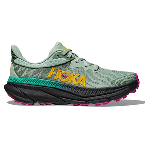 Hoka Challenger 7 Trail Shoes feature a green mesh upper with yellow \“HOKA\“ branding, a black midsole, and pink accents on the outsole, designed for trail running with enhanced grip and cushioning.