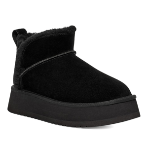 A black suede platform ankle boot with a fur lining and textured sole, designed for warmth and style.