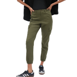 Olive green cargo jogger pants paired with black and white sneakers.