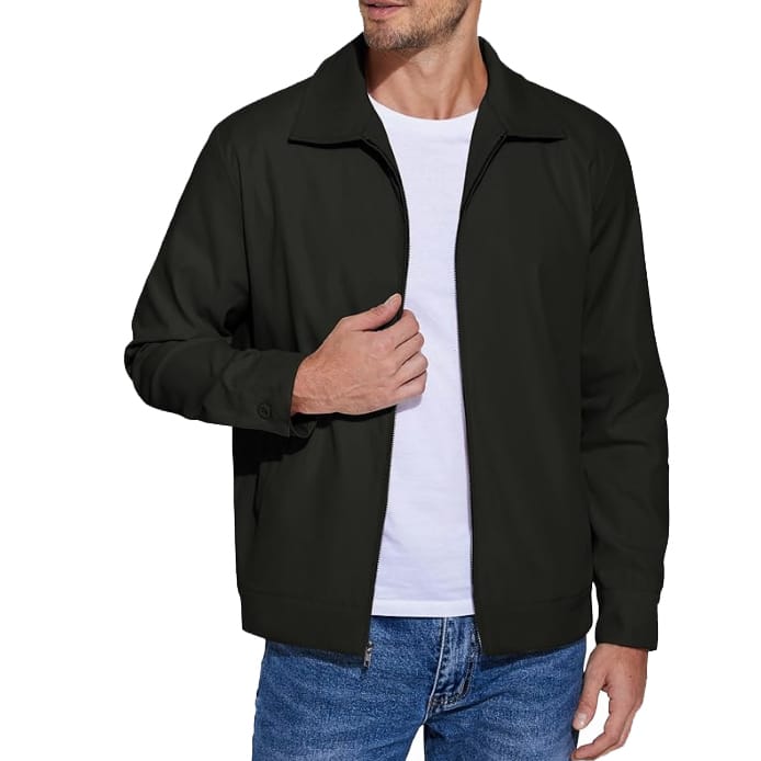 A dark colored cotton twill jacket with a front zipper, classic collar, and buttoned cuffs, worn over a white T-shirt and blue jeans.