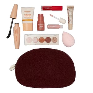 A makeup set featuring a mascara, face primer, cream blush, lip gloss, lip tint, eye shadow palette, beauty sponge, and makeup bag.