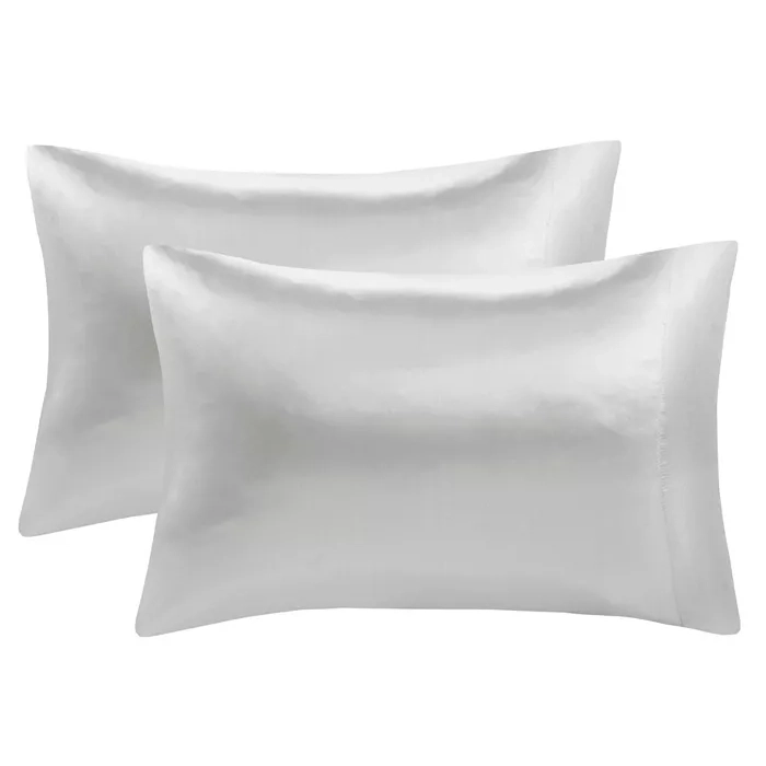 The Madison Park 2pk Pillowcase Set features a pair of smooth, white pillowcases that have a silky sheen, offering a luxurious and elegant look to bedding.
