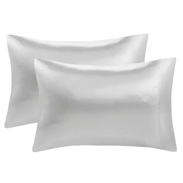 The Madison Park 2pk Pillowcase Set features a pair of smooth, white pillowcases that have a silky sheen, offering a luxurious and elegant look to bedding.