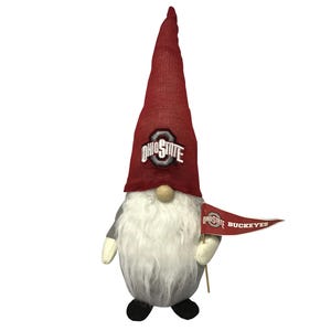 A gnome figure with a red hat featuring the Ohio State logo and holding a \“Ohio State Buckeyes\“ flag.