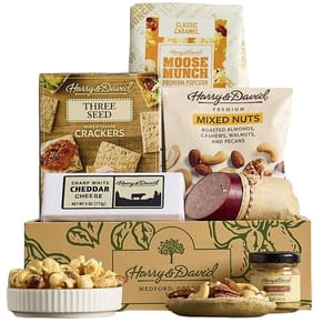 Gift box including Three Seed Crackers, Moose Munch Classic Caramel Popcorn, Mixed Nuts, Sharp White Cheddar Cheese, Royal Riviera Pears, and Sweet Hot Mustard, all from Harry & David.