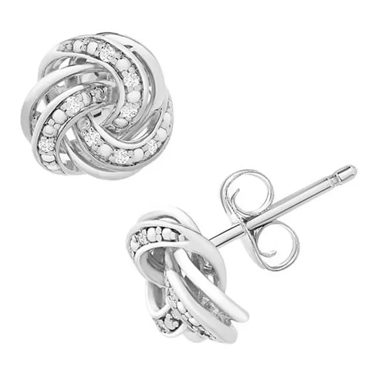 A pair of silver knot-style earrings with embedded rhinestones.