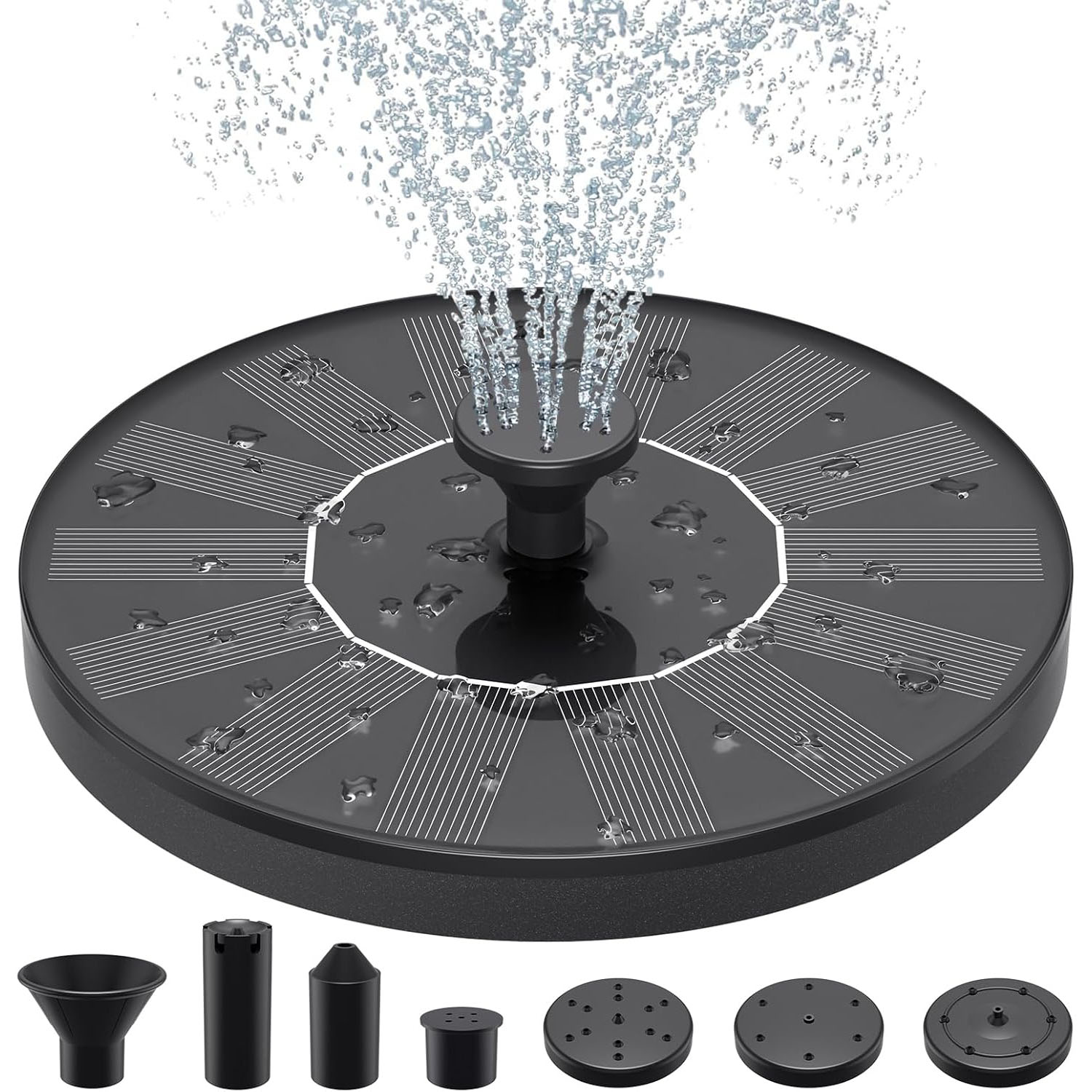 Round solar-powered fountain with a central water spray feature and multiple nozzle attachments for different spray patterns. The surface is covered with solar panels and is sprinkled with water droplets.