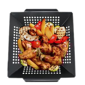 A black, nonstick grill wok with perforations is shown containing grilled chicken wings and assorted vegetables like red peppers, zucchini slices, onions, and potatoes.