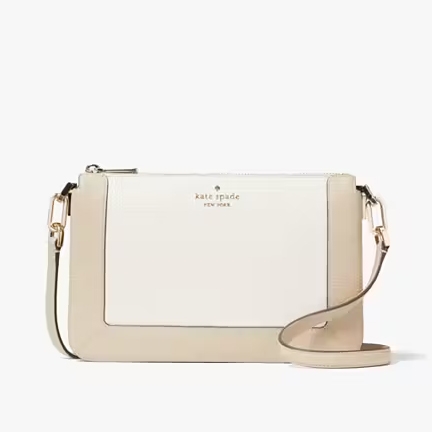 A beige crossbody bag with an adjustable strap and gold-tone hardware.