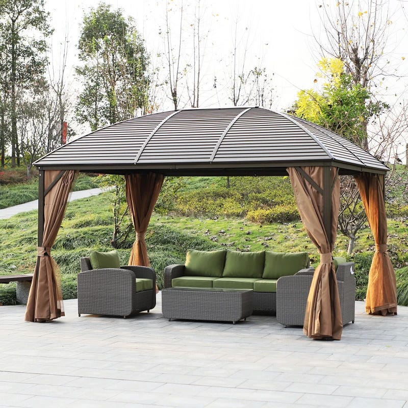 Outdoor patio set with a sofa and chairs under a gazebo with drapery.