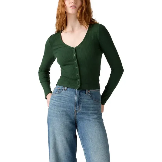 A person is wearing a fitted, long-sleeve green cardigan with buttons, paired with high-waisted blue jeans.