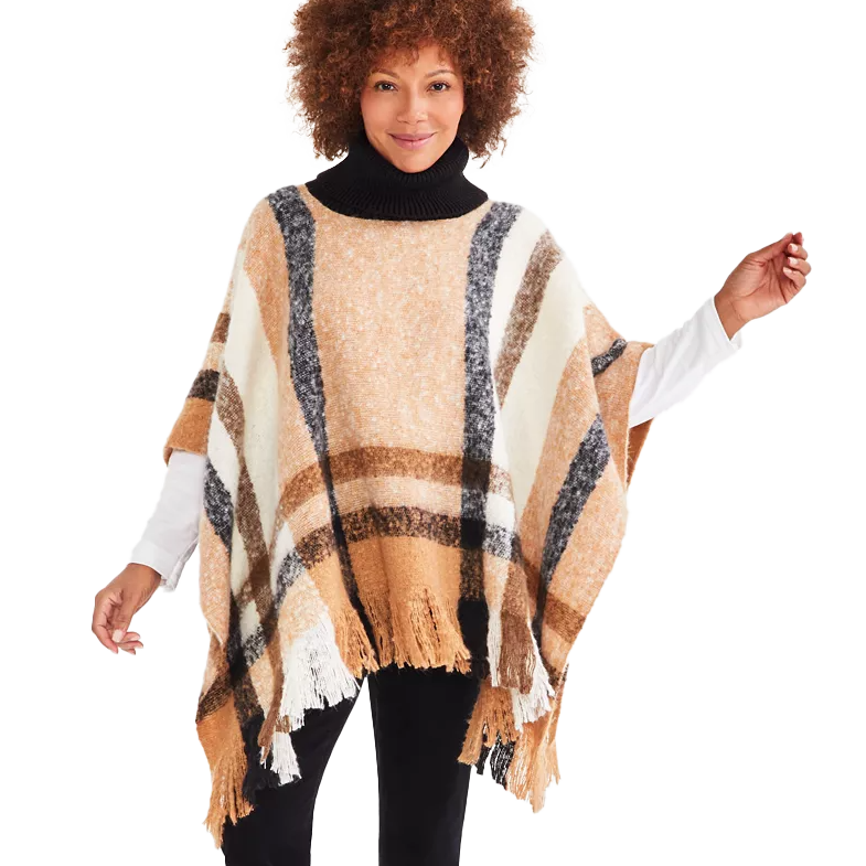 Plaid poncho with fringe hem, featuring a black turtleneck and a mix of tan, white, and gray colors.