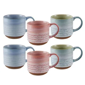 A set of six ceramic mugs featuring a speckled design in shades of blue, pink, and green, each with a large handle and an unglazed base.
