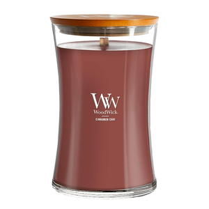 WoodWick candle with a wooden lid, labeled \“Cinnamon Chai,\“ featuring a crackling wick for a cozy sound.