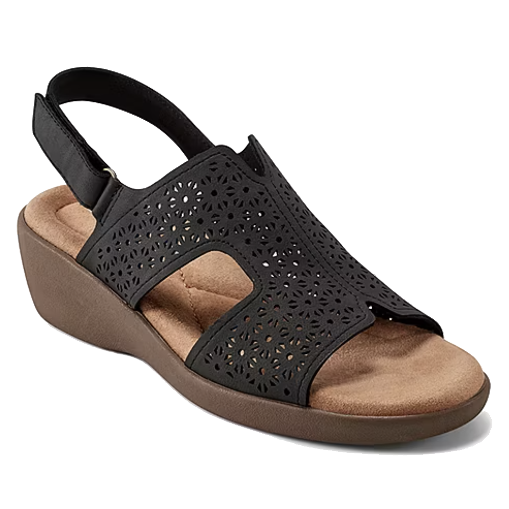 Black sandal with a cut-out, perforated design, featuring a slingback strap and cushioned footbed on a low wedge heel.