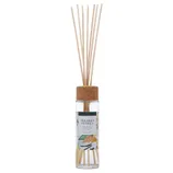 Reed diffuser with a cork lid, labeled \“Sugared Vanilla,\“ containing long wooden sticks for dispersing fragrance.