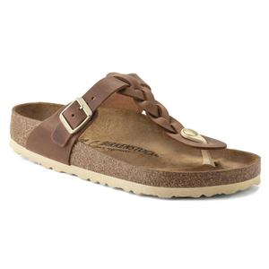 A brown Birkenstock sandal featuring a braided leather strap with a buckle and a toe loop, set on a cork footbed with a light-colored sole.