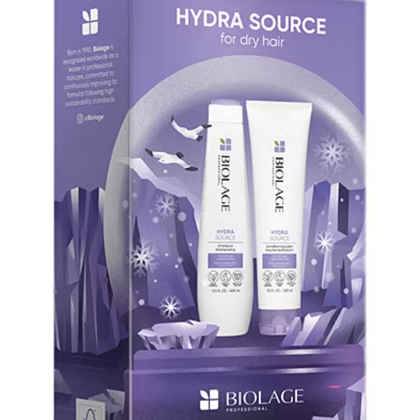 Biolage Hydra Source Set includes a shampoo and conditioner designed for dry hair. The packaging is purple with crystal and snow imagery, highlighting its moisturizing benefits.