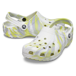 White and lime green Crocs Marbled Tie-Dye Clogs with a swirling pattern, featuring ventilation holes and an adjustable heel strap.
