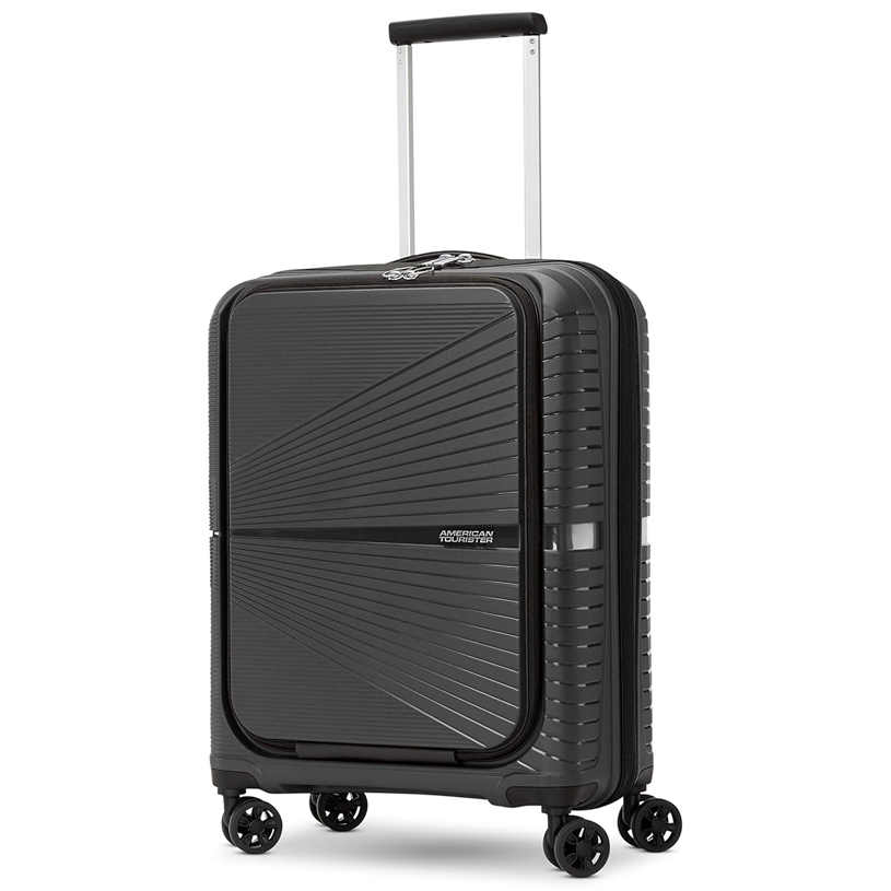 A black hard-shell suitcase with a textured design and four spinner wheels, featuring an extendable handle and a branded logo on the front.