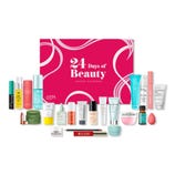 A beauty advent calendar from Ulta Beauty, labeled \“24 Days of Beauty,\“ featuring various skincare and cosmetic items, including creams, serums, lipsticks, powders, and tools from different brands, all displayed in front of a pink box.