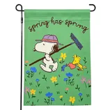 A colorful garden flag featuring cartoon characters enjoying a spring day with flowers, a rake, and a watering can, accompanied by the text \“spring has sprung.\“