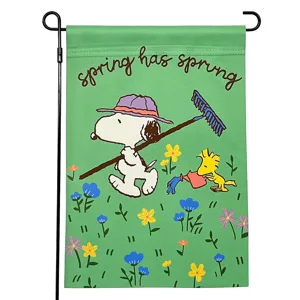 A colorful garden flag featuring cartoon characters enjoying a spring day with flowers, a rake, and a watering can, accompanied by the text \“spring has sprung.\“