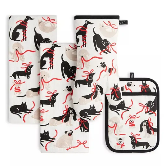 The 4-piece Kate Spade Pets Kitchen Textiles Set includes two dish towels, an oven mitt, and a pot holder. They are decorated with playful black and beige pet-themed designs featuring dogs and cats with red bows on a white background.