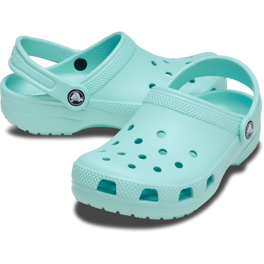 A pair of mint green Crocs clogs with ventilation holes and heel straps, featuring the Crocs logo on the side.
