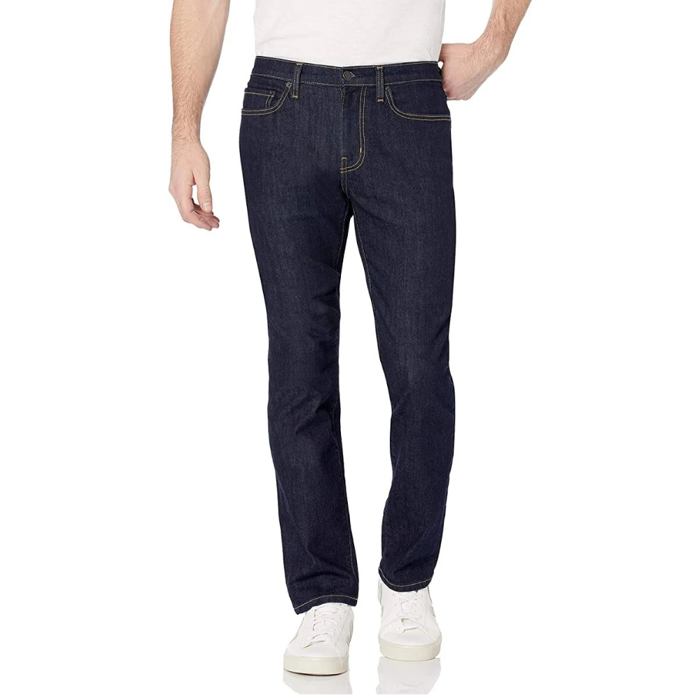Dark blue straight-leg jeans paired with white sneakers and a white T-shirt.