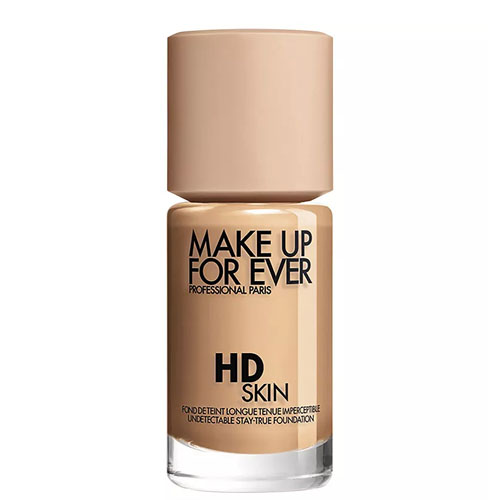 Make Up For Ever HD Skin Foundation is shown in a beige bottle with a minimalist design, featuring its branding and description.