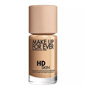 Make Up For Ever HD Skin Foundation is shown in a beige bottle with a minimalist design, featuring its branding and description.