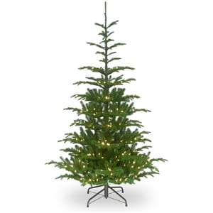 A 7.5-foot pre-lit artificial Christmas tree with a sparse, natural look, featuring evenly spaced branches and warm white lights on a sturdy stand.