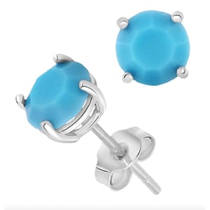 Silver earrings with round turquoise gemstones in a prong setting.