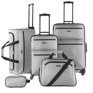A set of five silver-gray travel bags including suitcases, a duffle, a tote, and a small pouch, all with black trim and handles.