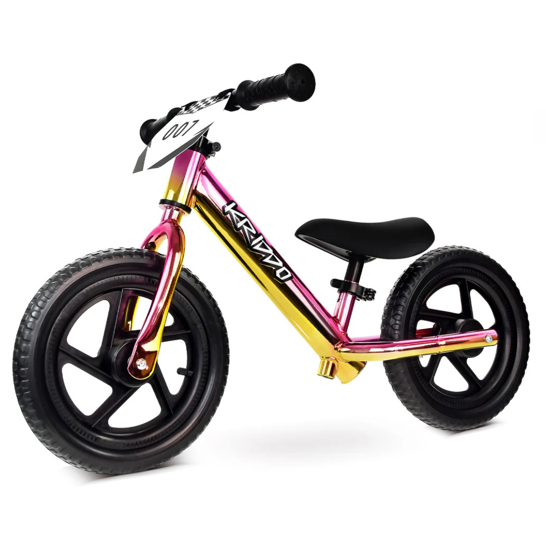 The KRIDDO Toddler Balance Bike features a colorful frame with a gradient design, two black wheels, and ergonomic handlebars. It includes a number plate labeled \“007\“ and is designed to help toddlers learn balance and coordination.