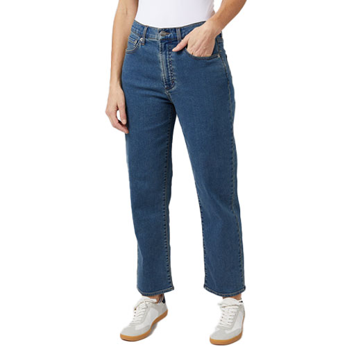 Comfort Relaxed Jeans in a medium blue wash, featuring a high waist and straight-leg cut, paired with white sneakers.