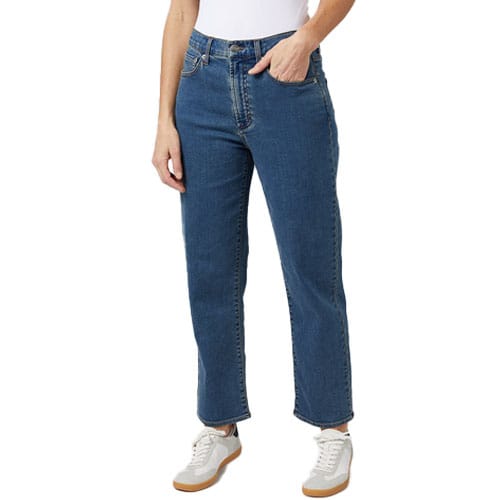 Comfort Relaxed Jeans in a medium blue wash, featuring a high waist and straight-leg cut, paired with white sneakers.