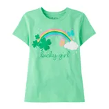 Green t-shirt featuring a rainbow, shamrocks, butterflies, and a cloud with the text \“lucky girl\“ on the front.