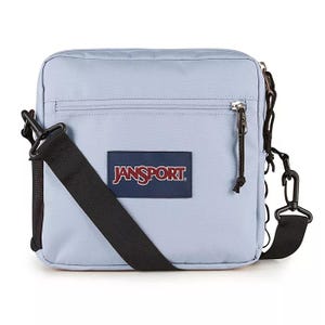 Light blue JanSport crossbody bag with a front zipper pocket and a black adjustable strap.