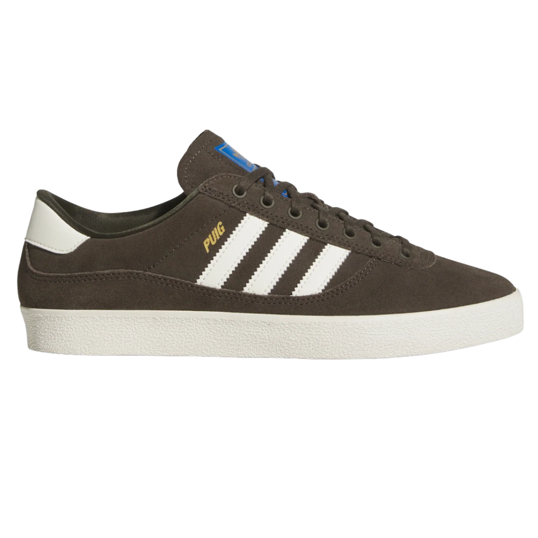 Adidas Puig sneakers in brown suede with white stripes, white midsole, and PUIG branding in gold.