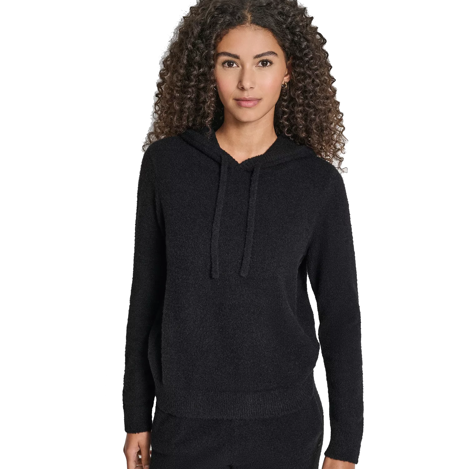 Woman wearing a black hooded sweater with drawstrings and a soft, textured fabric.