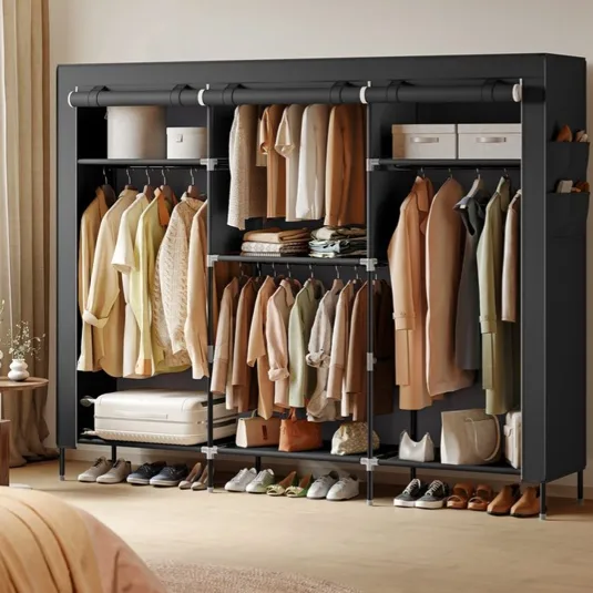 A SONGMICS freestanding wardrobe with multiple compartments is shown, displaying neatly organized clothing, shoes, and accessories in a bedroom setting.