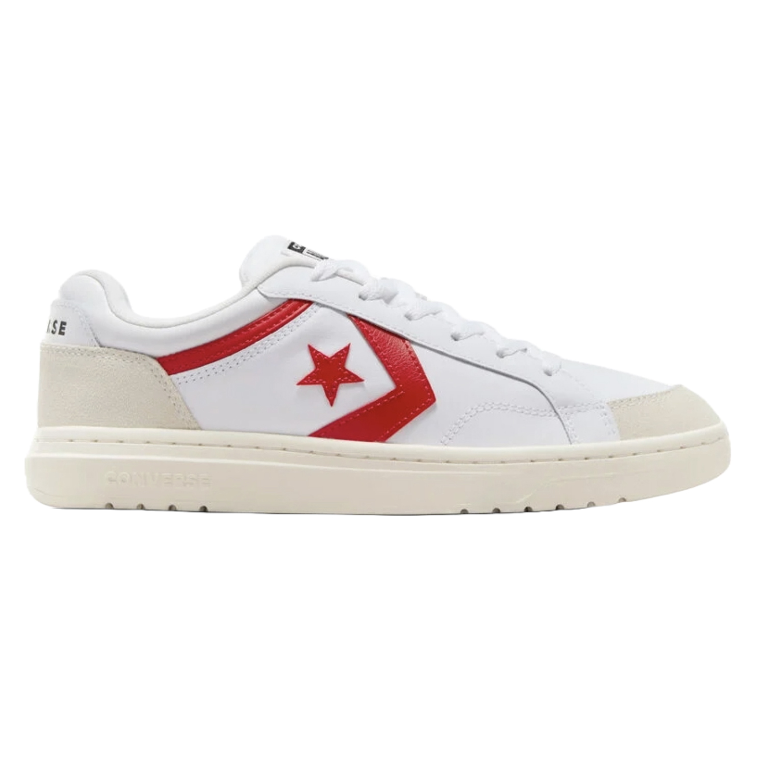 White low-top Converse sneakers with a red star and chevron logo; they feature a cream sole and black text accents along the side.