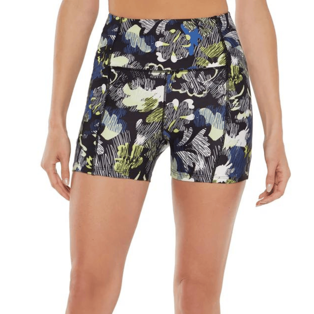 A pair of floral print shorts with a navy base and green, white, and blue brushstroke patterns.