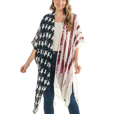 A woman is wearing a flowy wrap or kimono style garment with a design featuring stars and stripes, similar to an American flag, paired with jeans and a white top.