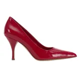 A red patent leather high-heeled pump with a pointed toe and textured finish.